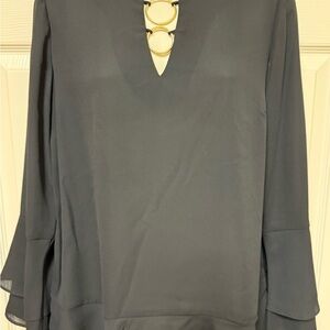 Elegant Black Women's Top with Gold Accents
Small spot on back of right sleeveve